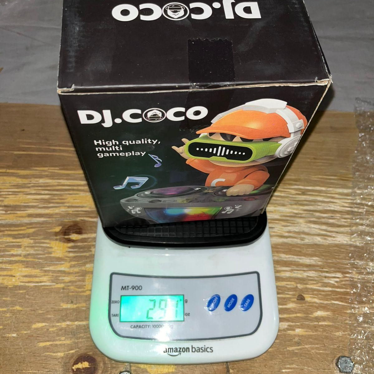 Dj.Coco product packaging on a digital scale with visible weight